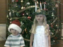 Rylee dressed as St. Lucia and Henry is Santa's Helper