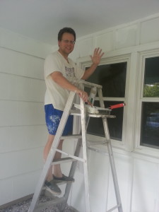 Dennis painting front of house