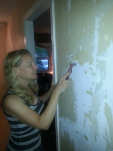 Scrapping wall paper in the hall