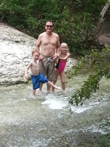 Henri and kids splashing in the creek