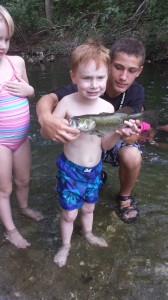 Henry and Rylee with some kids fishing at the park