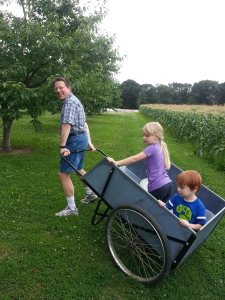 My brother, Dennis, carting the kids around