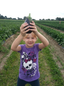 Rylee with an eggplant