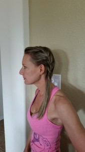 Bring rest of hair over to side to join with braid and place rubberband at nape of neck
